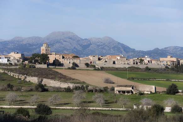 A town with a mountain as a backdrop